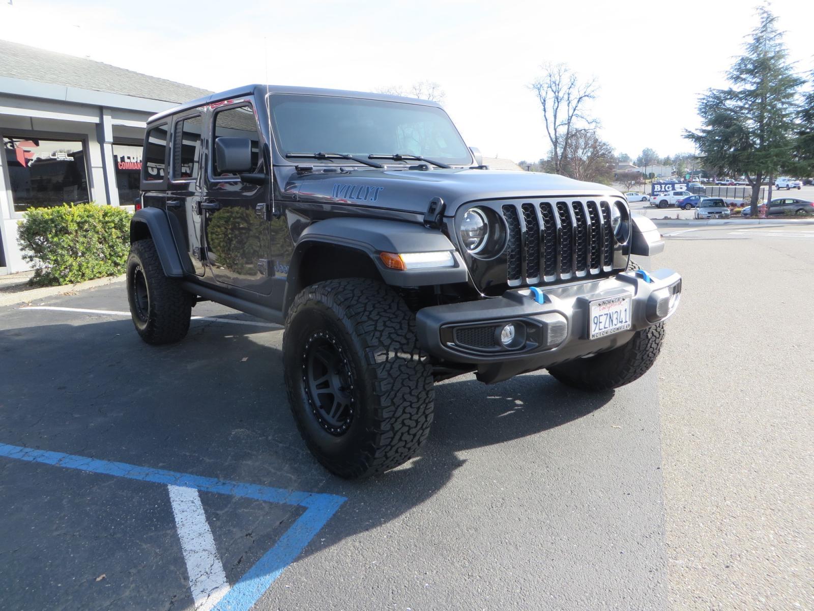 2023 CHARCOAL /black Jeep Wrangler Unlimited Willys 4XE (1C4JJXN68PW) with an 2.0L L4 DOHC 16V HYBRID engine, 8A transmission, located at 2630 Grass Valley Highway, Auburn, CA, 95603, (530) 508-5100, 38.937893, -121.095482 - 3" Zone Offroad lift kit, Fox Adventure series shocks, 17" Method Race wheels, 37" BFG KO2 tires, and a Teraflex spare tire carrier. - Photo #2